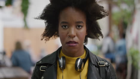 portrait-of-funky-african-american-woman-looking-unhappy-bored-in-urban-city-student-with-cool-afro-sad-expression