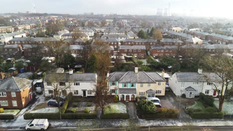 aerial view frosty white winter residential town neighbourhood rooftops rising dolly left