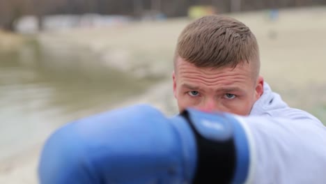 boxer boxing into camera lens slow motion boxer fight with shadow in nature boxing workout