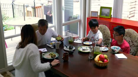 family members having breakfast on dining table 4k