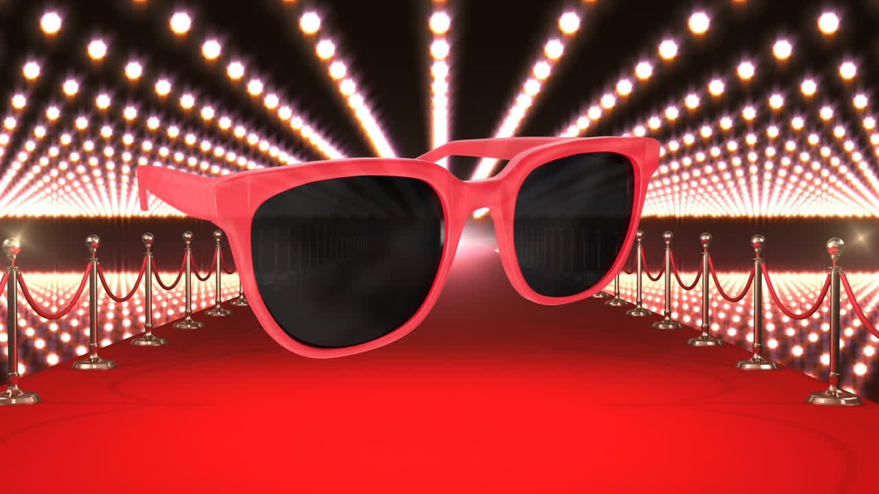 Tapis rouge et projecteurs avec animation de lunettes de soleil rouges.
