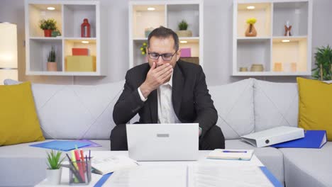 home office worker man is tired and sleepy.