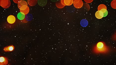 video composition with falling snow over blurry video of colorful lights
