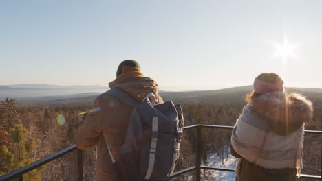 couple enjoying a winter mountain view