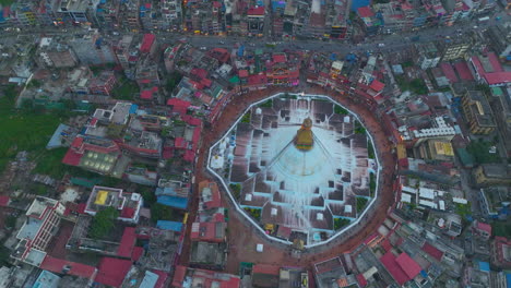 Boudha-Stupa-Nepal-Drone-Orbit-UNESCO-Heritage-Site,-landscape-of-Kathmandu-city,-highway-roads,-scenario-4K