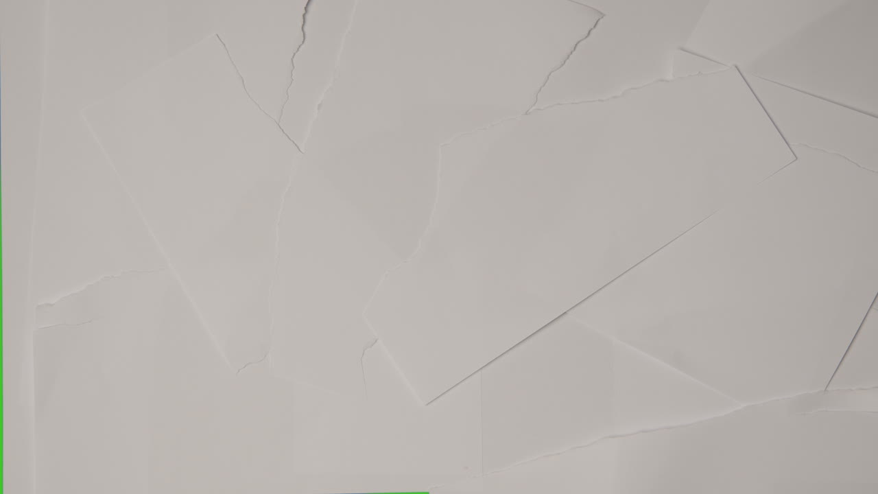 detener la secuencia de movimiento de pedazos de papel rasgados moviéndose para descubrir el fondo de la pantalla verde a continuación