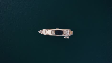 aerial directly above luxury yacht boat in blue mediterranean sea