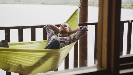 caucasian couple spending time at home, resting outside the cabin