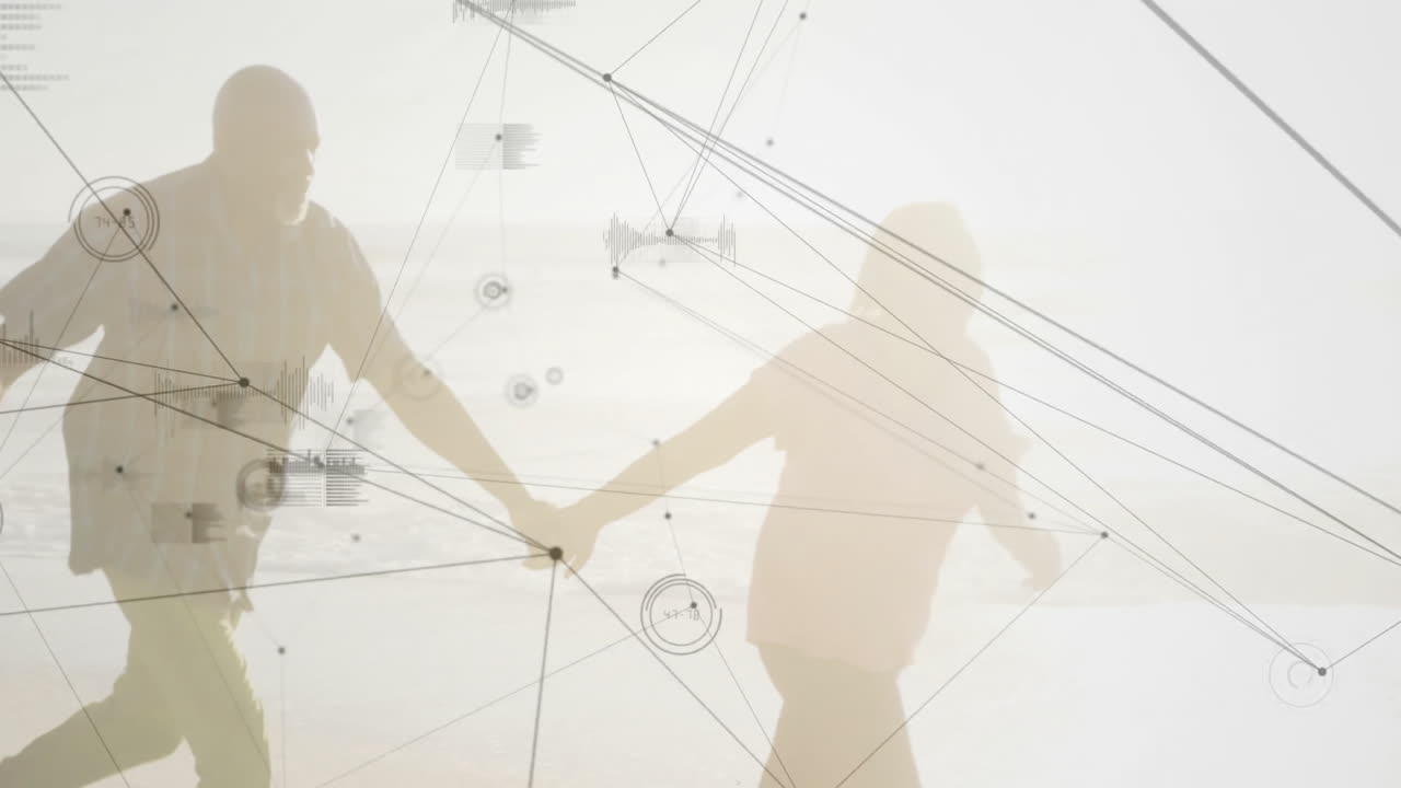 Man and woman holding hands on beach, exploring technology network lines and floating data charts
