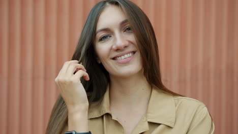 smiling woman with long brown hair