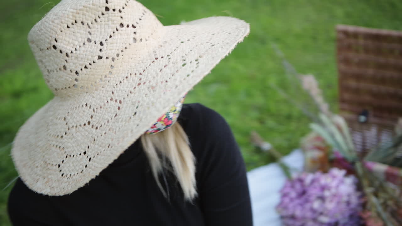 Fashionable girl wearing face mask flirting with camera at the park
