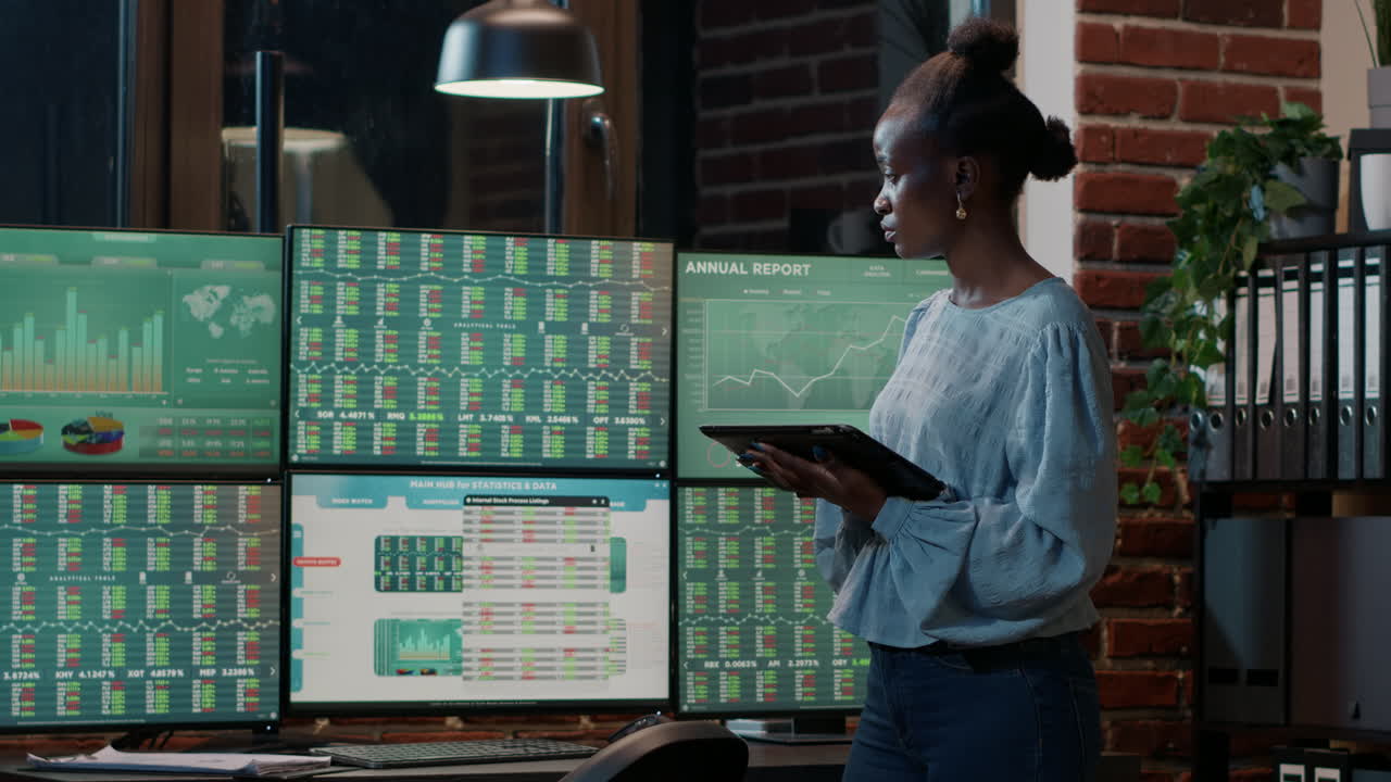 Hedge fund trader following stock market sales on digital tablet