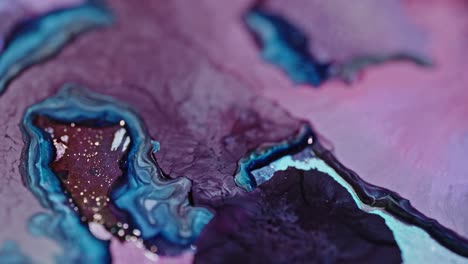 close-up of vibrant blue and purple ink diffusing in water, creating an abstract art look