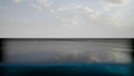 a beautiful view of the ocean with blue sky and white clouds