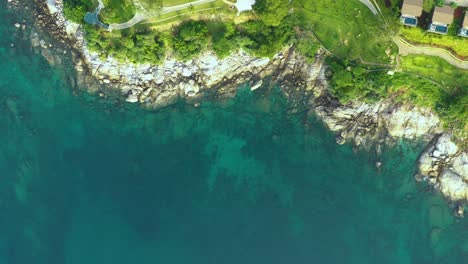 Aerial-panorama-of-tropical-resort-territory-and-beach,-beautiful-Andaman-sea-at-west-coast-of-Phuket-Island