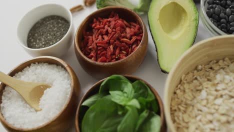 video of close up of fresh apple and bowls of plant based ingredients