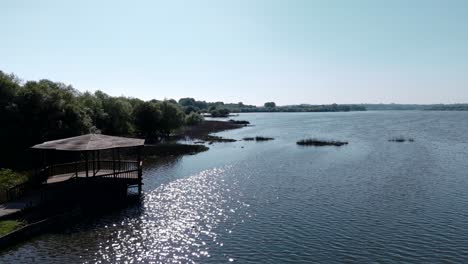 Aerial-view-of-Pateira-de-Fermentelos-with-approach-deck-and-serene-lake-waters-in-Aveiro