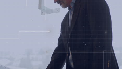 businessman working in office with data processing animation over grid background