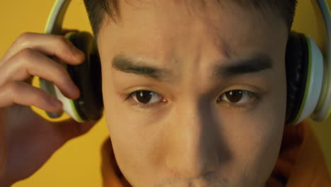 man wearing headphones and listening to music