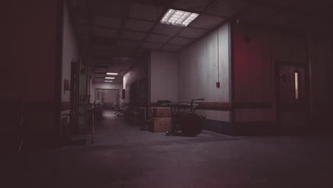 dark hallway in abandoned building with scattered medical equipment at night