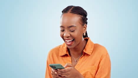 Woman,-laugh-and-typing-with-smartphone-in-studio