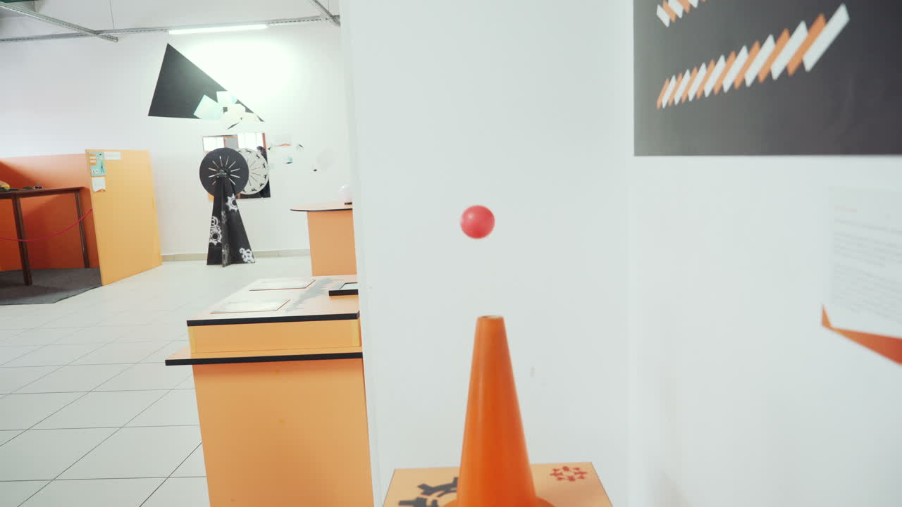 Ball flying over the air flow. Child in the Research Center.
