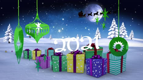 decoraciones de navidad de 2021 colgando contra regalos de navidad en el paisaje de invierno
