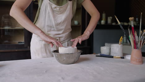 woman making pottery