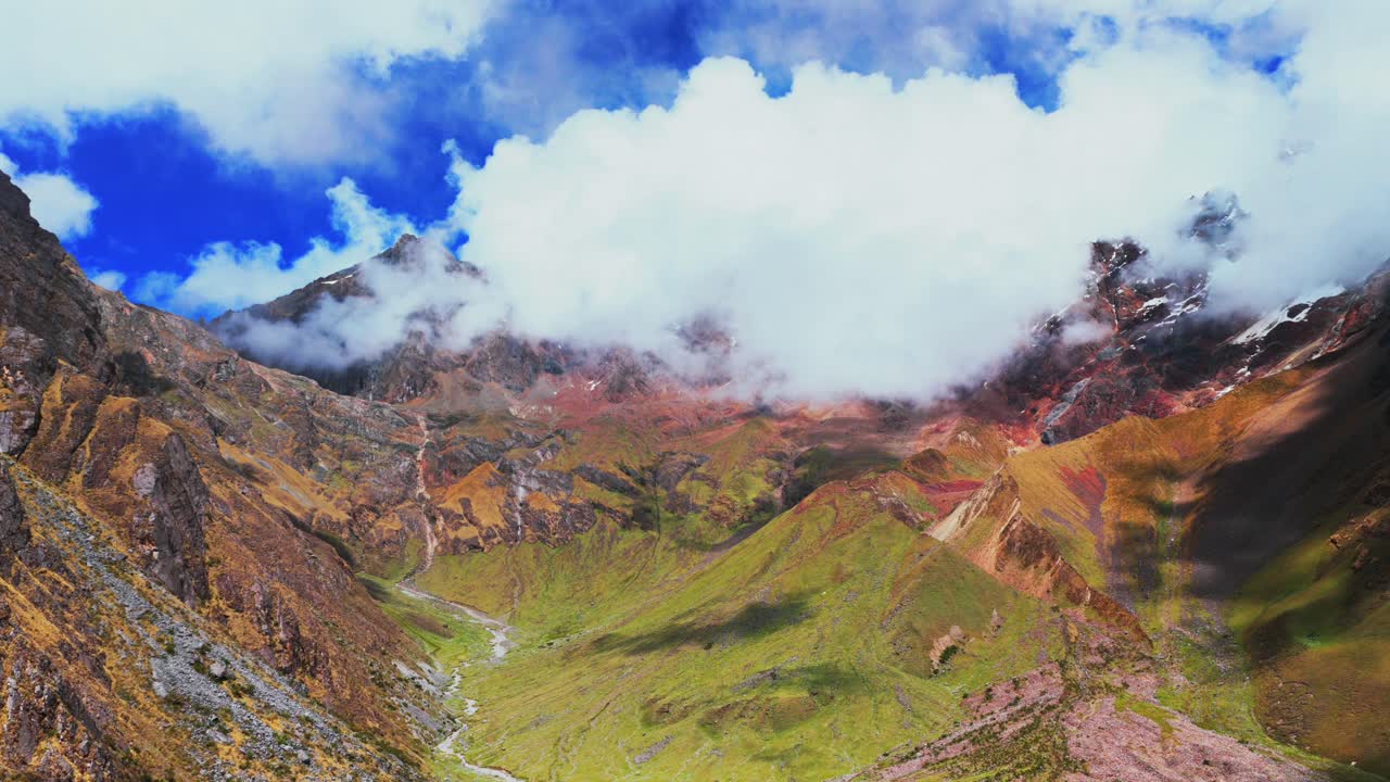 Peruvian Andes range Laguna Lake Humantay trek snow capped high altitude glacier Humantay Salkantay mountain trek Peru aerial drone rainy season sunny morning fog clouds hiking Cusco forward upwards