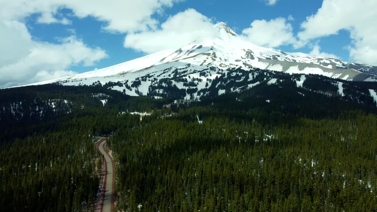 US, Oregon, Mt Hood, Bennett Pass, 2025-04-22 - Drone view of Mt Hood outside of Portland. On a spring day, with some clouds, viewed from the Southeast at Mt Hood Meadows