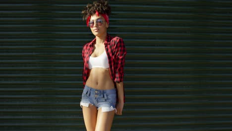 sexy african american young woman leaning on wall