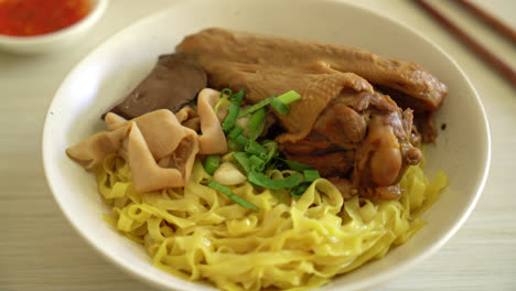 egg noodles served dry with braised duck - asian food style