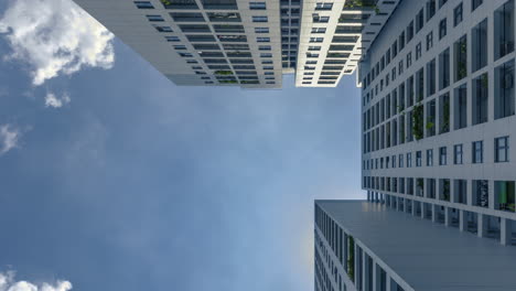 color time lapse of residential architecture 4k color time lapse from low angle looking up to architecture and dramatic clouds moving upward through the scene