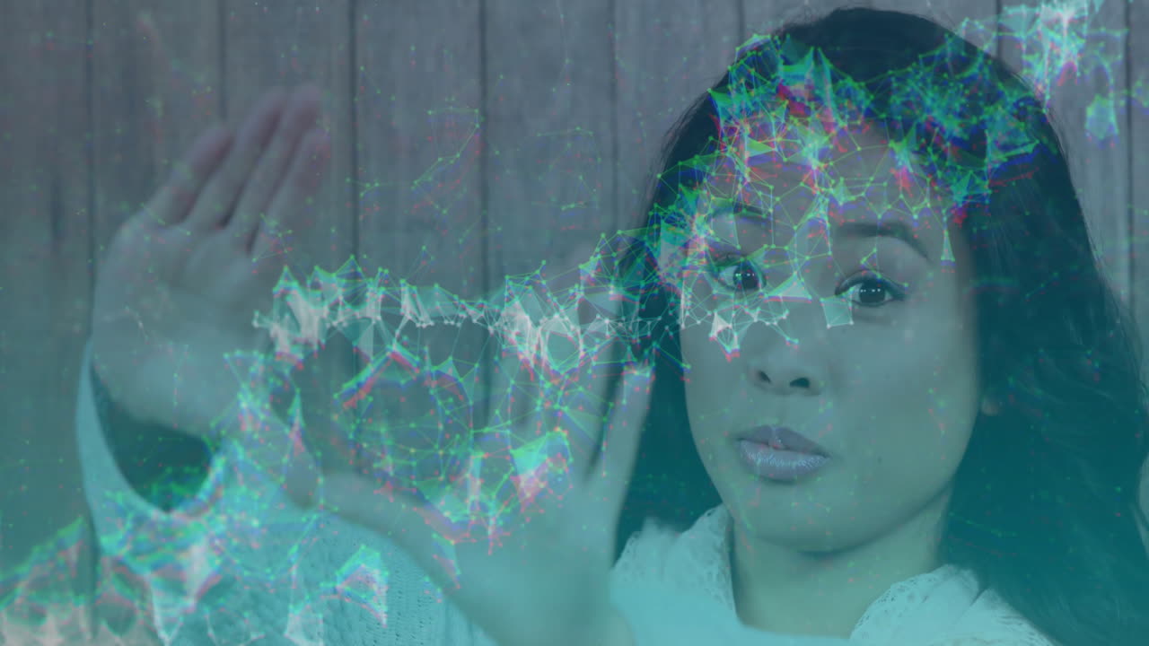 Woman interacting with digital network animation overlay on wooden background