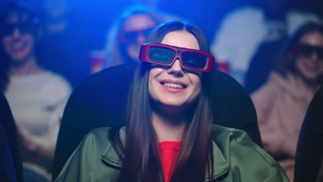 girl watching film in 3d glasses