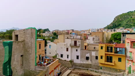 descending aerial shot between old destroyed historic buildings on sicily island