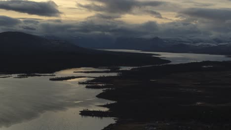 Cloudy-Evening-Sky-Over-Lake-In-Swedish-Lapland-Near-Kebnekaise-Mountain-At-Dusk