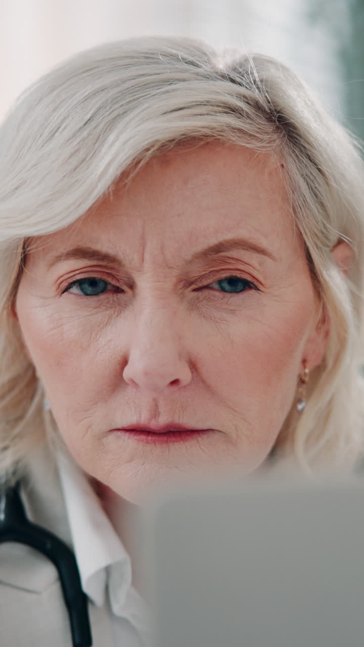 Close Up of Mature Woman Doctor with Focused Expression