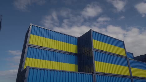 ukraine flag containers are located at the container terminal. ukrainian export or import concept