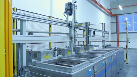 Production-line-with-movable-conveyor-machine.-Industrial-equipment-at-factory