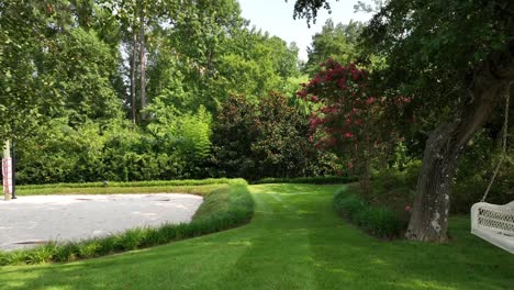 mmerse-yourself-in-the-heart-of-leisure-with-this-captivating-footage-of-a-vibrant-Club-Racquet-Court-field,-complemented-by-a-charming-white-basket-swing