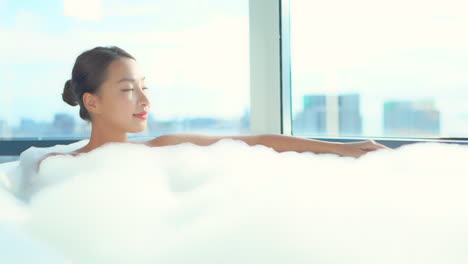 Close-up-of-an-attractive-woman-up-to-her-neck-in-a-bubble-bath