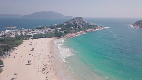 Tropical, beautiful Shek O Beach, a white sandy stretch of sand in Hong Kong Island. Aerial drone view