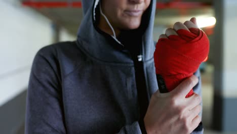 woman wearing red band in hand 4k