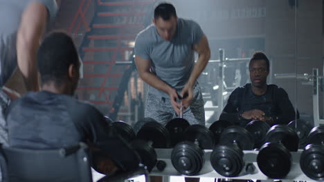 man in wheelchair lifting weights at gym confident man in wheelchair performs shoulder press exercise with dumbbells at modern gym demonstrating strength fitness and determination