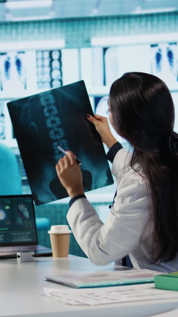 Doctor Discussing X-Ray Results with Male Patient in Medical Office