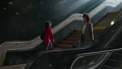 two people on an escalator