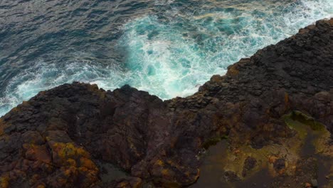 Rocky-Cliff-At-The-Shoreline-In-Coastal-Town-Of-Kiama-In-Australia