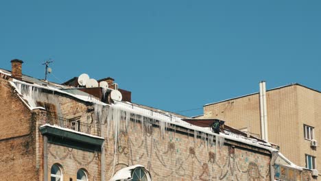 winter scene of an old building with icicles
