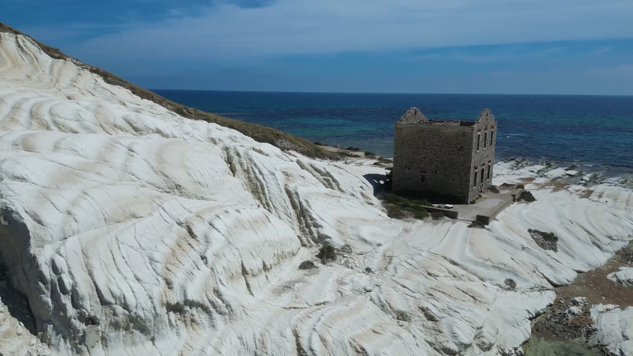 Aerial drone footage of Punta Bianca, Sicily: white limestone cliffs, turquoise sea, and untouched coastline. Perfect for travel, nature, and cinematic landscape projects
